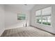 Cozy bedroom with natural light, artwork, and neutral carpet at 107 Weslyn Trace Dr, Durham, NC 27703