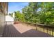 Expansive back deck perfect for outdoor entertaining with a view of the home's private, wooded backyard at 107 Weslyn Trace Dr, Durham, NC 27703