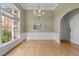 Elegant dining room with hardwood floors, a chandelier, and large windows at 107 Weslyn Trace Dr, Durham, NC 27703