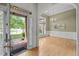 View of the entryway leading to a dining room with hardwood floors and a chandelier at 107 Weslyn Trace Dr, Durham, NC 27703