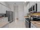 Well-equipped kitchen with stainless steel appliances and white cabinets at 107 Weslyn Trace Dr, Durham, NC 27703