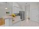Bright kitchen with breakfast bar and stainless steel refrigerator at 107 Weslyn Trace Dr, Durham, NC 27703