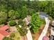 Breathtaking aerial view highlights the property's sprawling landscape and serene natural surroundings at 107 Whitby Ct, Cary, NC 27511