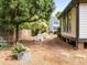 Well-maintained backyard featuring mature trees, stepping stones and pretty foliage, offering a tranquil outdoor setting at 107 Whitby Ct, Cary, NC 27511