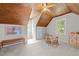 Spacious bonus room featuring wood-paneled ceiling, two windows, and carpet at 107 Whitby Ct, Cary, NC 27511