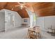 Large bonus room with carpet, wooden ceiling, and bonus storage area at 107 Whitby Ct, Cary, NC 27511