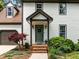 Inviting front entrance with a decorative door, brick steps, and mature landscaping at 107 Whitby Ct, Cary, NC 27511