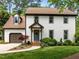 Charming two-story home with a landscaped front yard, attached garage and cozy covered entryway at 107 Whitby Ct, Cary, NC 27511