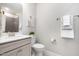 Well-lit bathroom featuring a modern vanity with stone countertop and neutral-toned walls at 108 Sunburst Dr, Durham, NC 27705