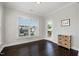 Bedroom with hardwood floors, natural light, and a door to the outside at 108 Sunburst Dr, Durham, NC 27705