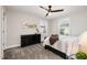 Bright bedroom with neutral walls, carpeting, and a ceiling fan, showcasing its cozy ambiance at 108 Sunburst Dr, Durham, NC 27705