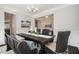 Cozy dining room with dark wood table, upholstered bench, and decorative chandelier at 108 Sunburst Dr, Durham, NC 27705