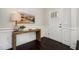 Inviting entryway with a decorative table, painting, and stylish dark hardwood floors at 108 Sunburst Dr, Durham, NC 27705