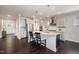 Modern kitchen featuring stainless steel appliances, granite countertops, and dark wood floors at 108 Sunburst Dr, Durham, NC 27705