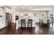 Bright kitchen with white cabinetry, stainless steel appliances, and granite countertops at 108 Sunburst Dr, Durham, NC 27705