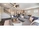 Open-concept living room and kitchen with hardwood floors, comfortable seating, and modern decor at 108 Sunburst Dr, Durham, NC 27705