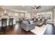 Open-concept living area with hardwood floors, modern decor, and plenty of natural light at 108 Sunburst Dr, Durham, NC 27705