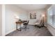 Bright office featuring a desk, chair, lamp, and patterned rug on neutral carpeting at 108 Sunburst Dr, Durham, NC 27705