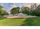 Backyard with a covered pool, patio, seating, and sprawling lawn at 11 Pine Forest Dr, Siler City, NC 27344