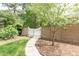 Backyard entrance with a white gate and brick wall at 11 Pine Forest Dr, Siler City, NC 27344