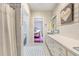 Bathroom featuring a retro aesthetic with patterned wallpaper and vintage fixtures at 11 Pine Forest Dr, Siler City, NC 27344