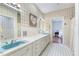 Bathroom featuring a retro aesthetic with patterned wallpaper and vintage fixtures at 11 Pine Forest Dr, Siler City, NC 27344