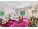 Comfortable bedroom featuring a plush rug, large windows, and natural light at 11 Pine Forest Dr, Siler City, NC 27344