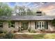 Elegant brick home featuring a bay window, a welcoming front door, and manicured landscaping, creating a warm curb appeal at 11 Pine Forest Dr, Siler City, NC 27344