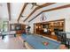 Entertainment room with a pool table, foosball table, television, and access to a living space at 11 Pine Forest Dr, Siler City, NC 27344