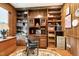 Cozy home office featuring custom wood shelving, a desk, and storage solutions at 11 Pine Forest Dr, Siler City, NC 27344