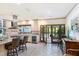 An expansive kitchen with granite island seating, wine cooler, and backyard French doors at 11 Pine Forest Dr, Siler City, NC 27344