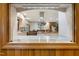 Kitchen showcasing an island, stainless steel range hood, and natural light at 11 Pine Forest Dr, Siler City, NC 27344