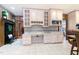 Bright kitchen features modern desk area with upper and lower cabinets plus view into den at 11 Pine Forest Dr, Siler City, NC 27344