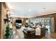 Spacious living room with a fireplace, leather furniture, and view of the pool room at 11 Pine Forest Dr, Siler City, NC 27344