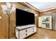 Stylish entertainment area with a large flat screen television and a unique storage cabinet at 11 Pine Forest Dr, Siler City, NC 27344
