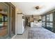 Enclosed outdoor kitchen featuring modern appliances and serene views of the surrounding landscape at 11 Pine Forest Dr, Siler City, NC 27344
