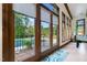 Patio access with views of the outdoor pool and lush greenery, bringing the outdoors in at 11 Pine Forest Dr, Siler City, NC 27344