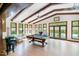 Expansive pool room with vaulted ceilings, natural light, and easy access to the outdoors for leisure and enjoyment at 11 Pine Forest Dr, Siler City, NC 27344