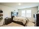 Cozy bedroom with neutral tones, bright natural light, and well-placed decor at 1108 Orchard Stream Dr, Haw River, NC 27258
