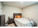 Well-lit bedroom with wooden furniture and warm, colorful accents at 1108 Orchard Stream Dr, Haw River, NC 27258