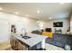 Open-concept kitchen and living room, perfect for entertaining guests and Gathering at 1108 Orchard Stream Dr, Haw River, NC 27258
