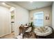 Bright office space featuring a desk, comfortable chair, and peaceful backyard view at 1108 Orchard Stream Dr, Haw River, NC 27258