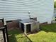 Exterior view showcasing the central air conditioning unit at 1211 Odyssey Dr, Durham, NC 27713