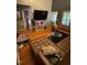 Open living room with modern furniture, hardwood floors, and large screen television at 1211 Odyssey Dr, Durham, NC 27713