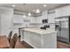 Spacious kitchen with granite countertops, stainless steel appliances, and a convenient center island at 1230 Wingstem Pl, Raleigh, NC 27607