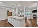 Spacious kitchen island offering plenty of counter space for preparing meals and hosting guests at 1230 Wingstem Pl, Raleigh, NC 27607