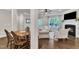 Inviting living room with fireplace, hardwood floors, and open access to dining area at 1230 Wingstem Pl, Raleigh, NC 27607