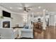 Spacious living area with a cozy fireplace, hardwood floors, and open layout at 1230 Wingstem Pl, Raleigh, NC 27607