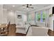 Cozy living room boasts hardwood floors, natural light, and seamless access to outdoor space at 1230 Wingstem Pl, Raleigh, NC 27607