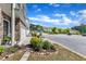 Street view of townhomes with manicured lawns and mature landscaping in a suburban neighborhood at 1230 Wingstem Pl, Raleigh, NC 27607